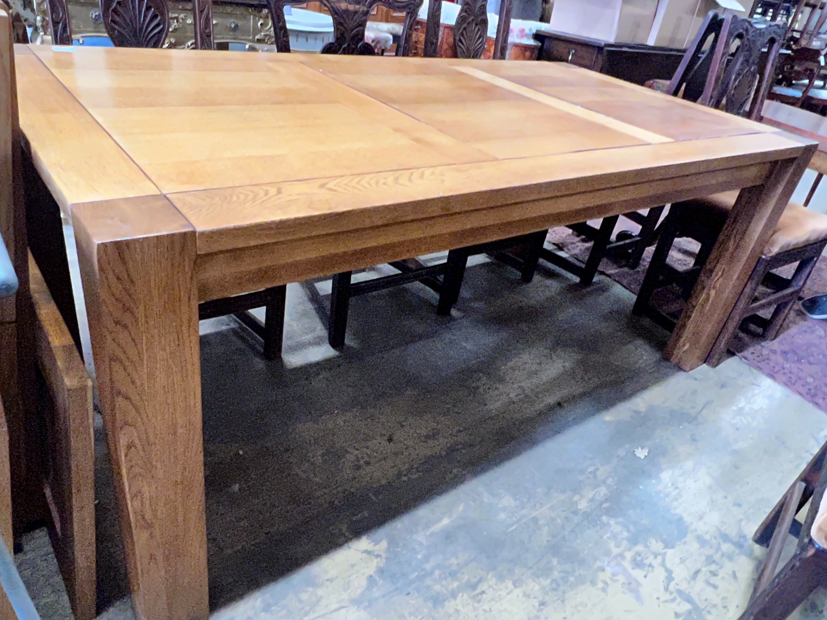 A large contemporary rectangular oak dining table, with removable end leaves, length 280cm extended, width 90cm, height 75cm